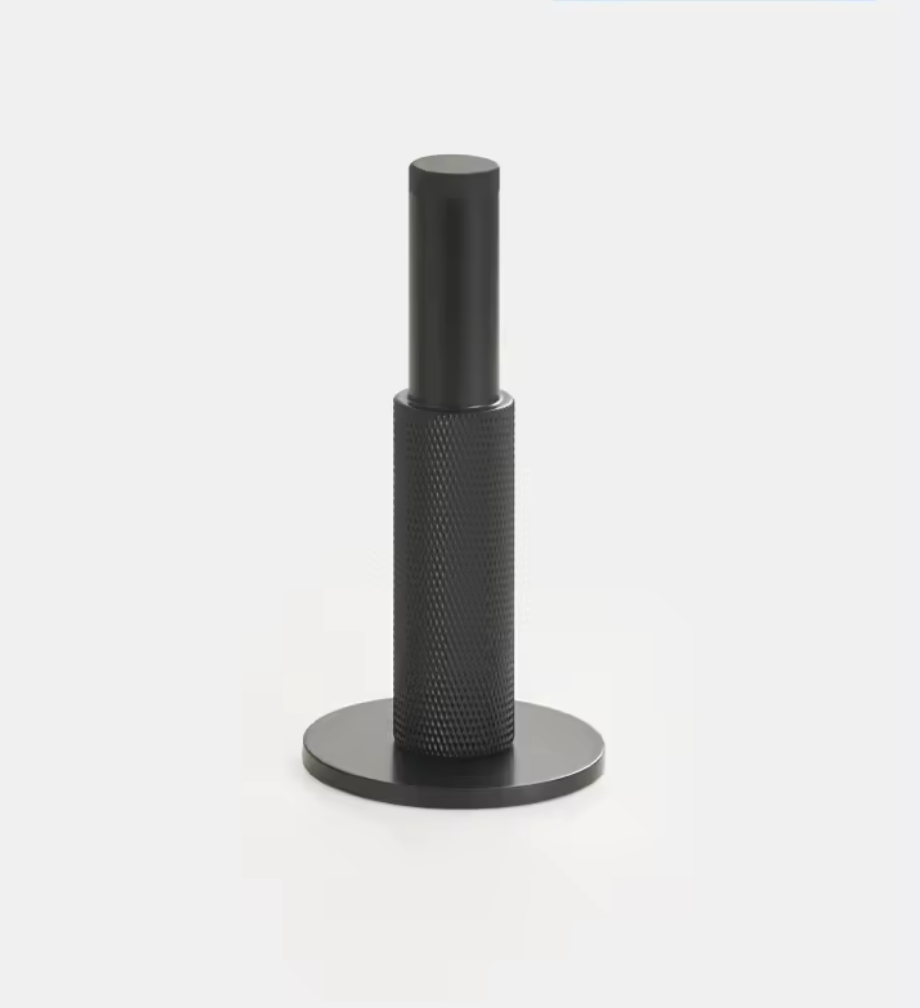 Black brass door stop standing from the floor
